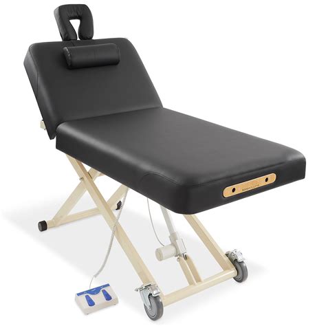 The table features professional-grade craftsmanship, including a sturdy hardwood frame along with double tension knobs on each leg for extra stability. . Saloniture massage table